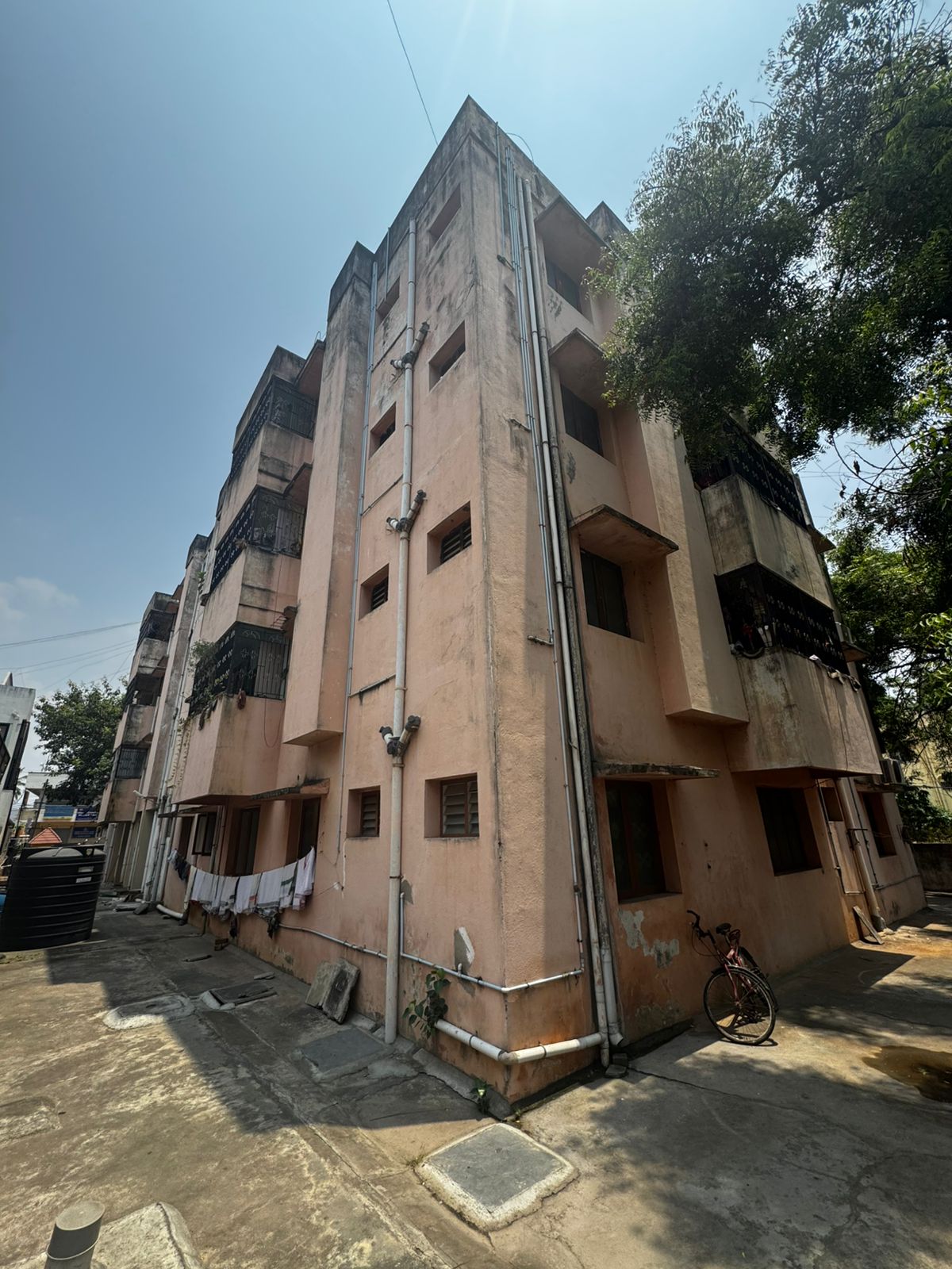 Multi-storey residential building exterior photographed during a site review